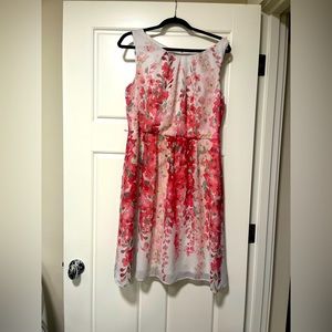 Knee length white dress with orange leaves